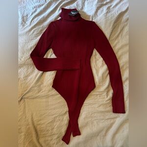 Red. Turtleneck body suit. Size small. Never worn